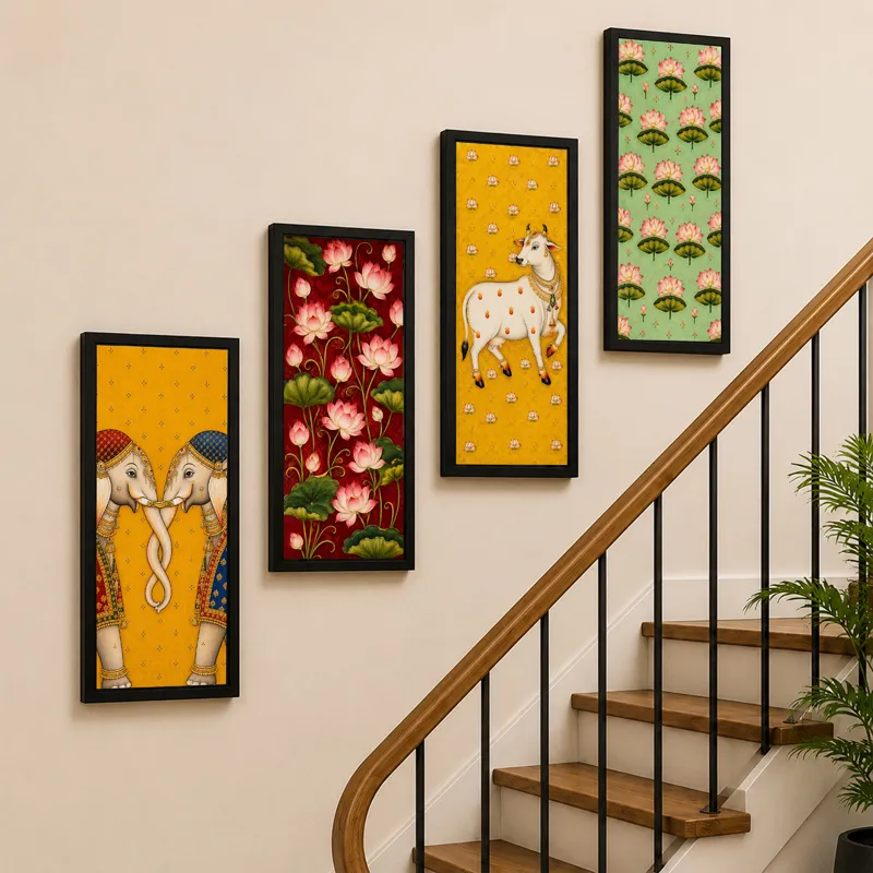 Four framed Pichwai artworks arranged along a staircase wall.