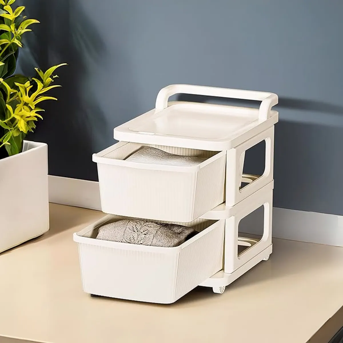 White storage rack with open drawers against a dark wall