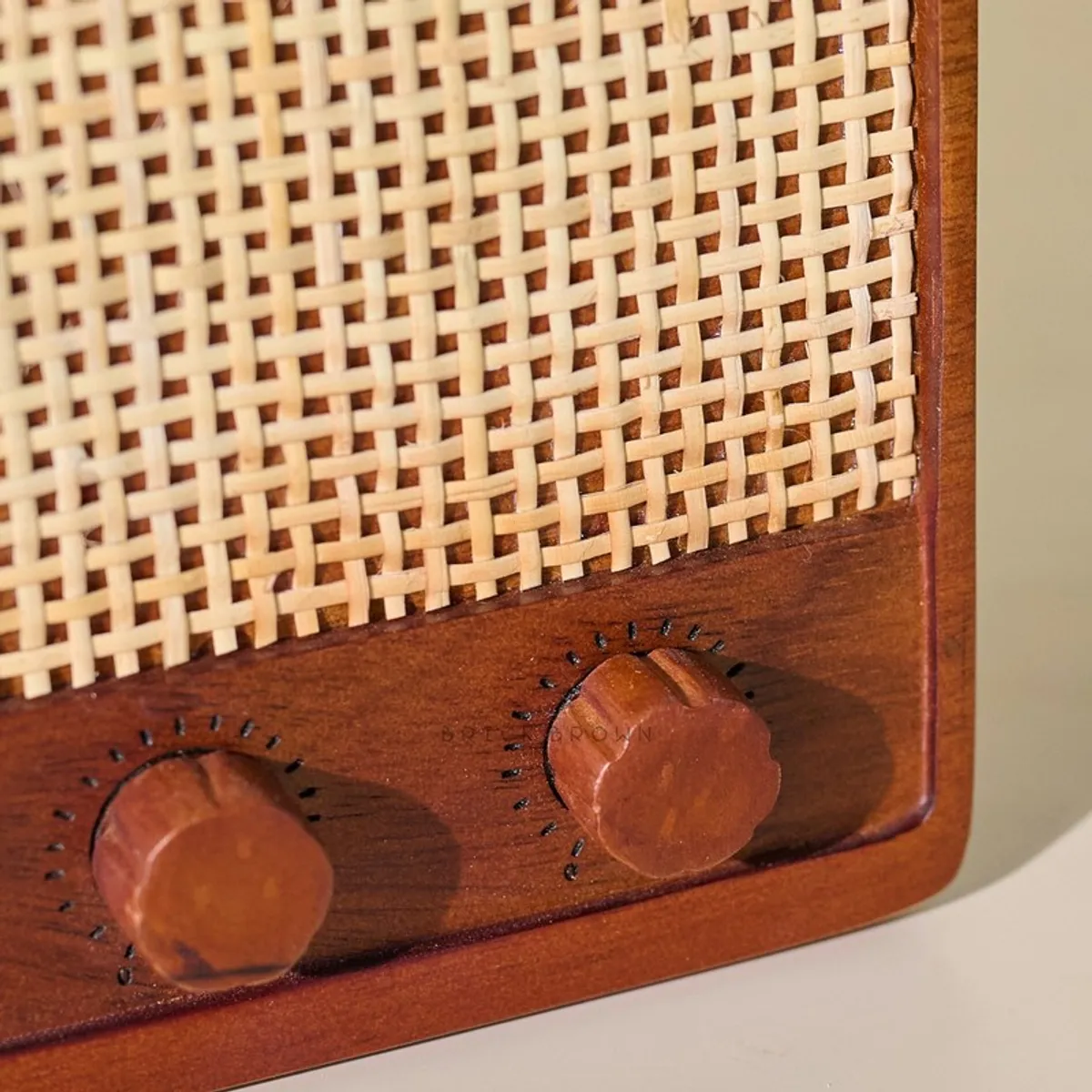 Close-up of woven texture and carved knob detail on wooden stand