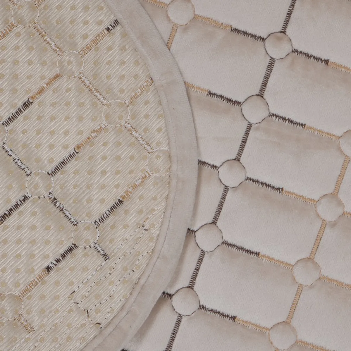 Rolled beige sofa cover showing its patterned surface and reverse side