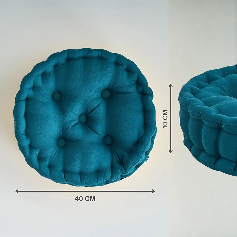 Top and side view of a round botanical green floor cushion.