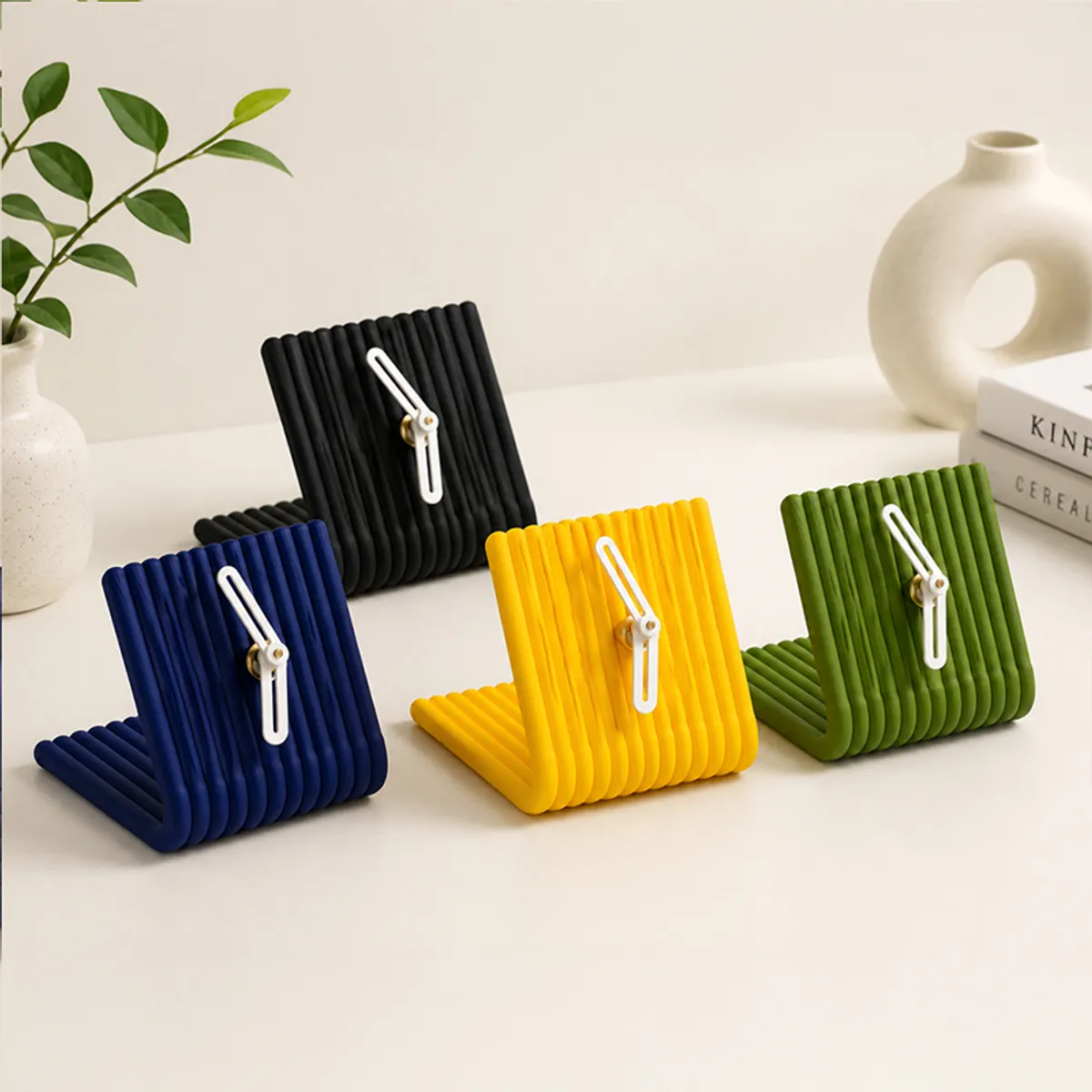 Black arch table clock shown with blue, yellow and green colour variants
