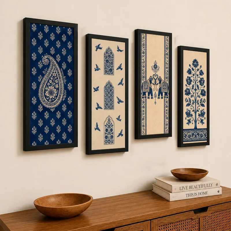 Set of four framed blue and cream wall art panels displayed above a wooden console.
