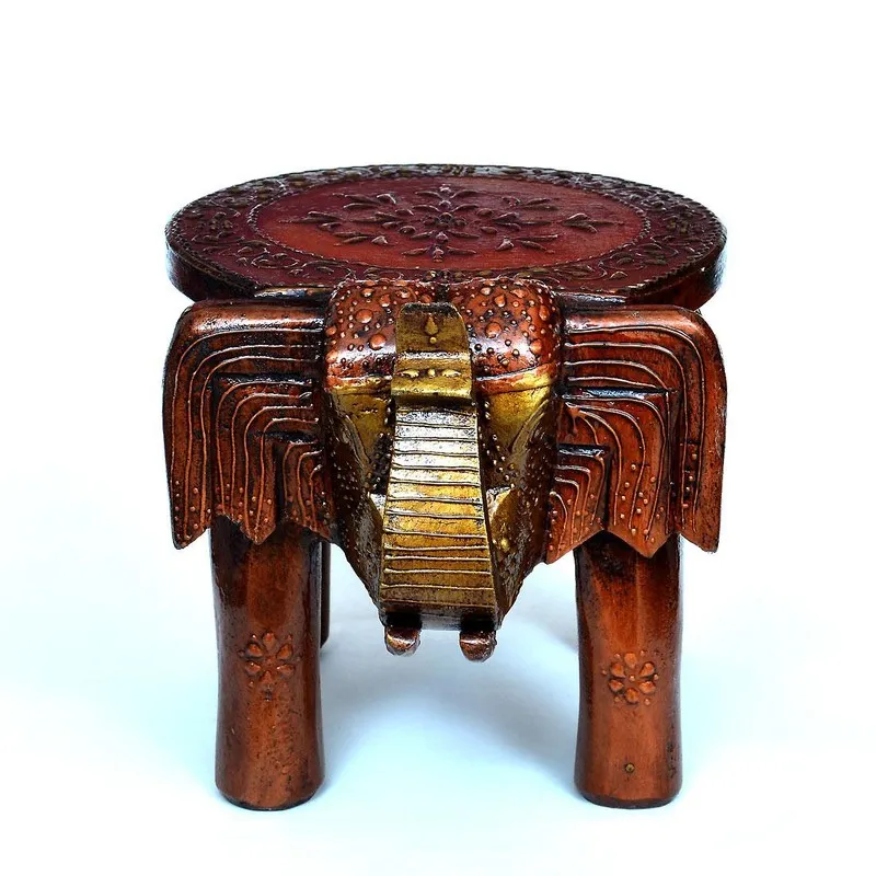 Front view of brown carved wooden stool with round top