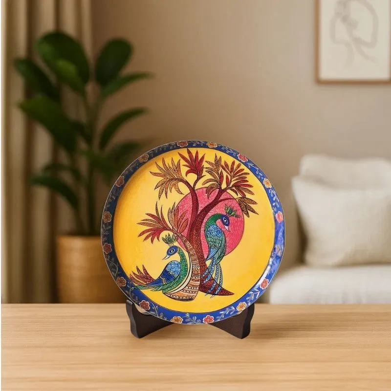 Multicolour peacock wall plate displayed upright on a stand on a table