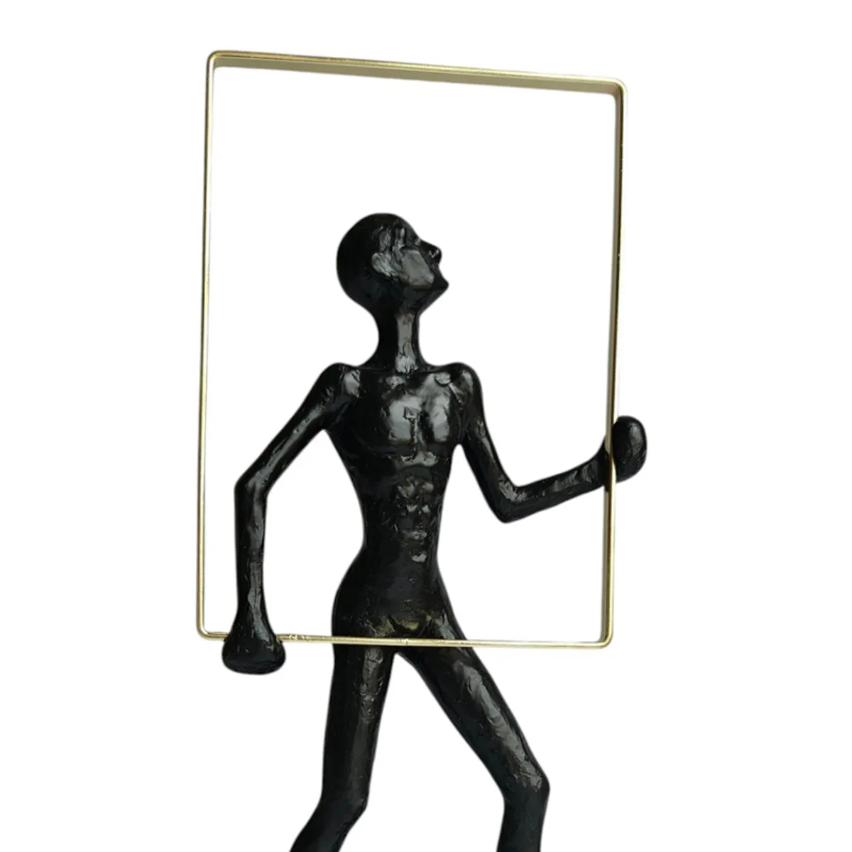 Close view showing the black abstract figurine and gold rectangular frame