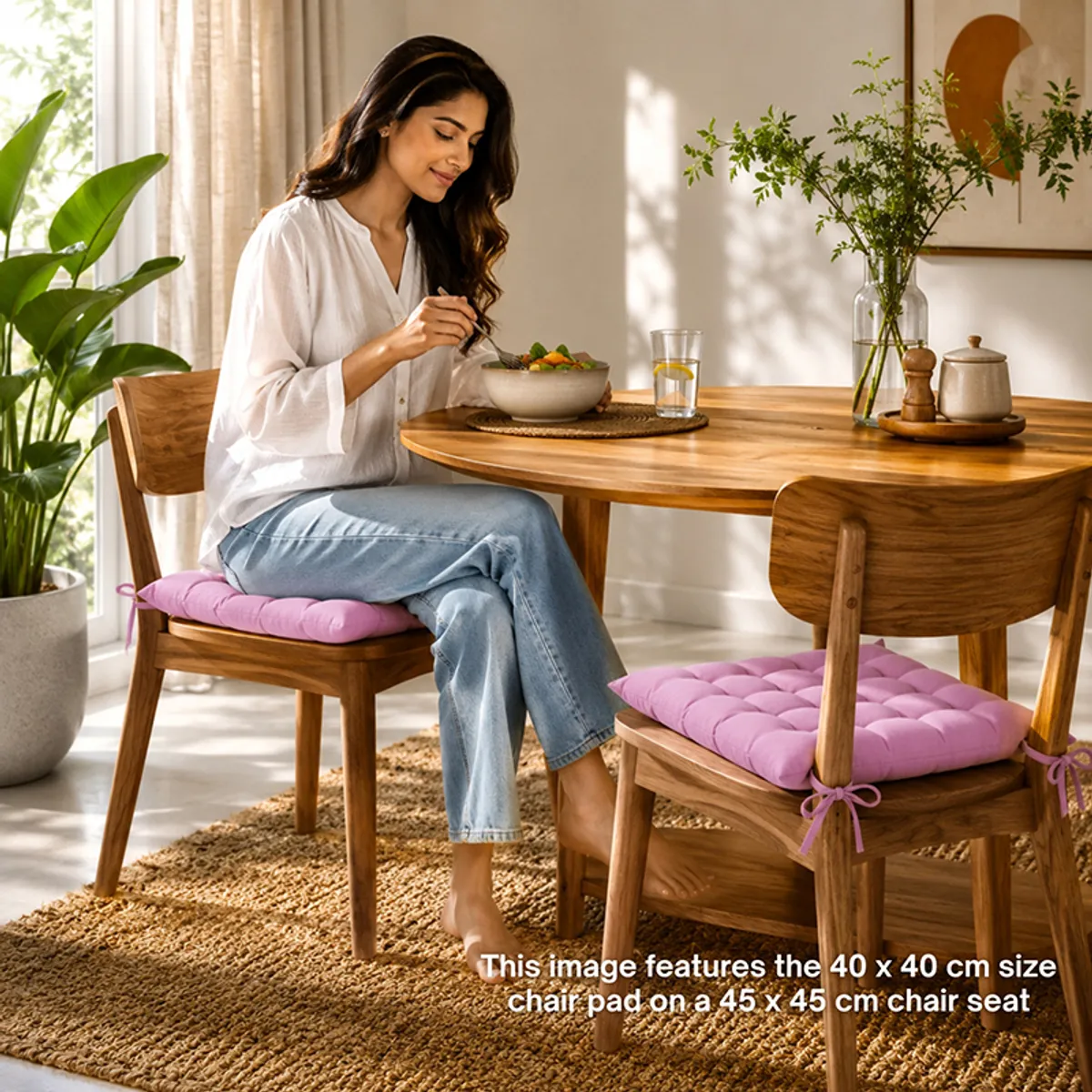Lilac purple chair pads placed on wooden dining chairs