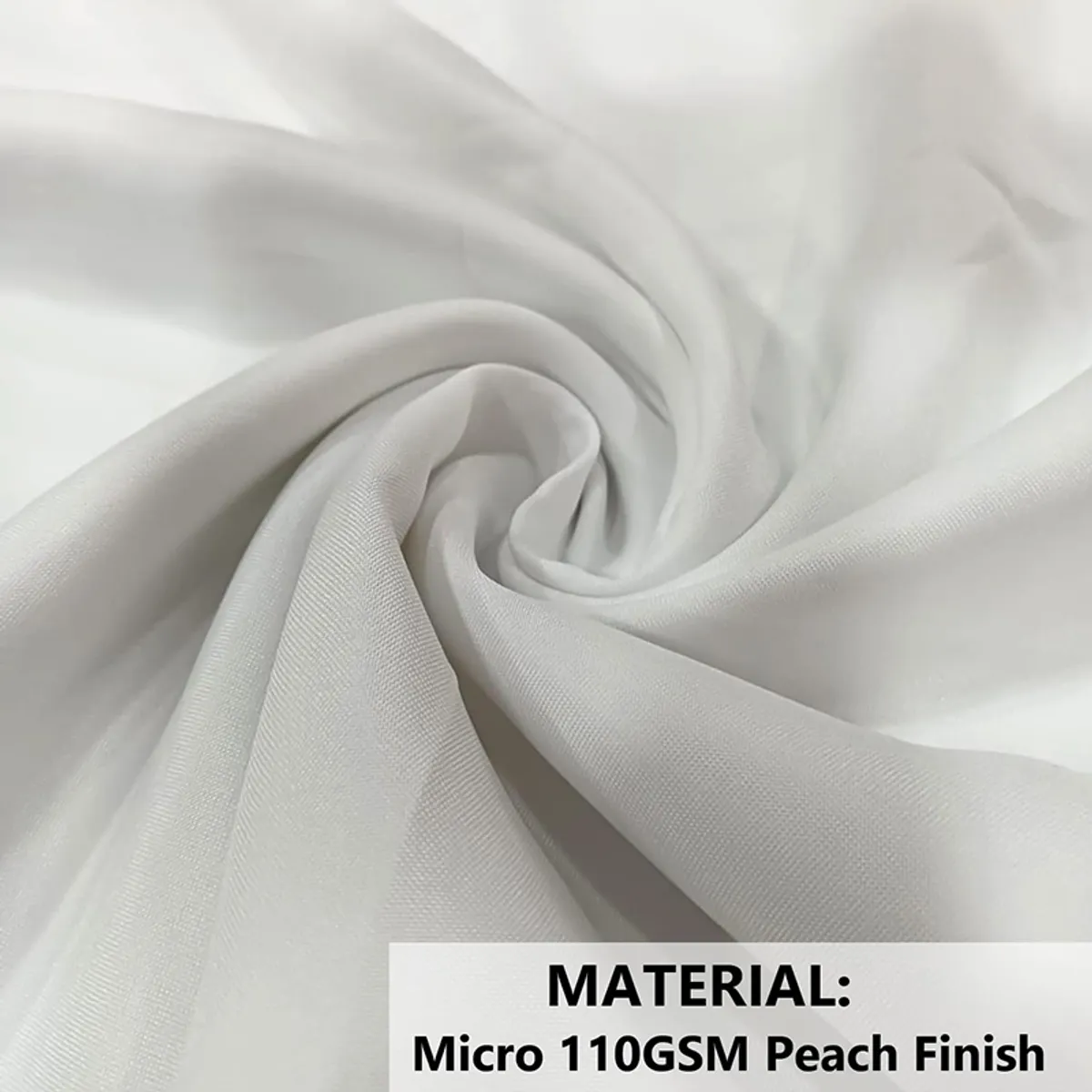 Close-up of light-coloured cushion cover fabric with a soft drape.