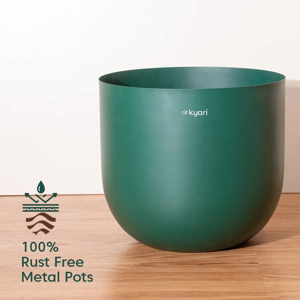 Close view of a rounded teal metal planter