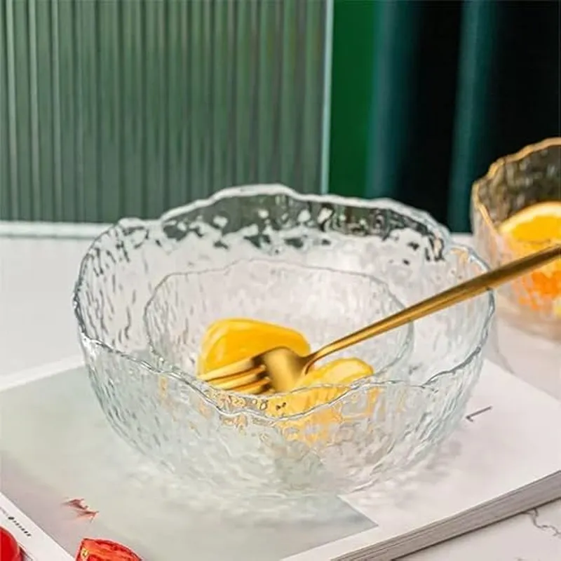 Transparent glass bowl with glossy textured finish holding sliced fruit