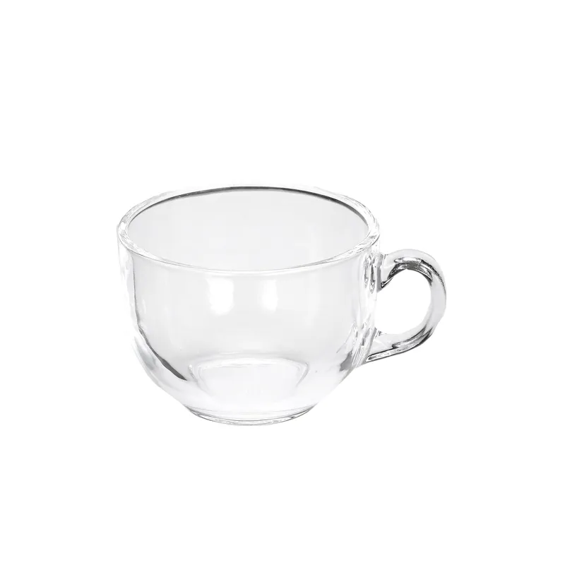 Single transparent glass tea cup with a handle on a white background