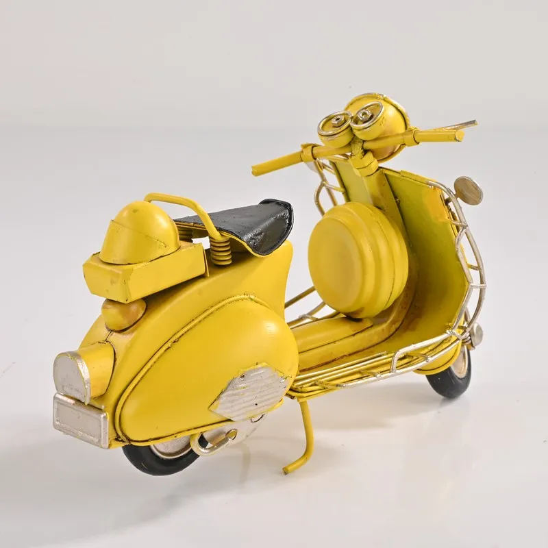 Back angled view of yellow scooter tabletop showpiece on white background