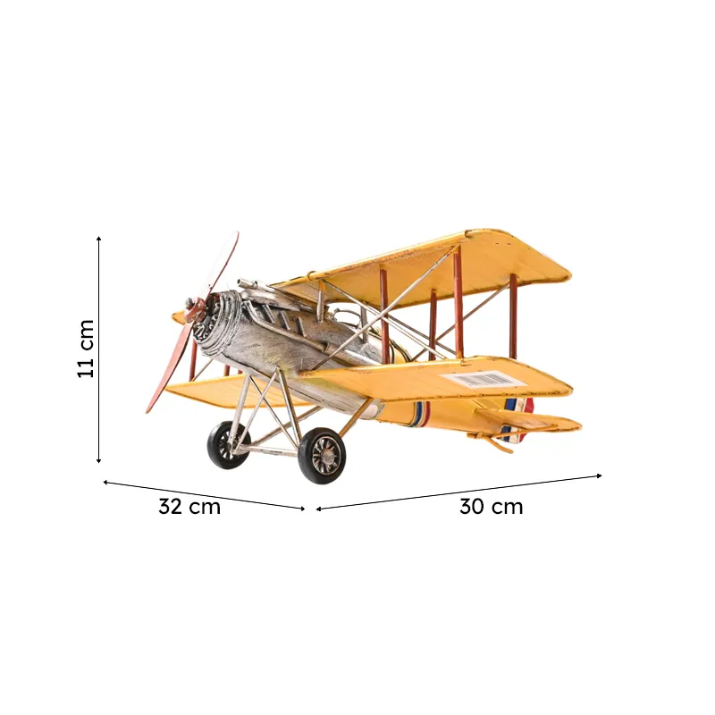 Yellow vintage biplane tabletop showpiece on a white background