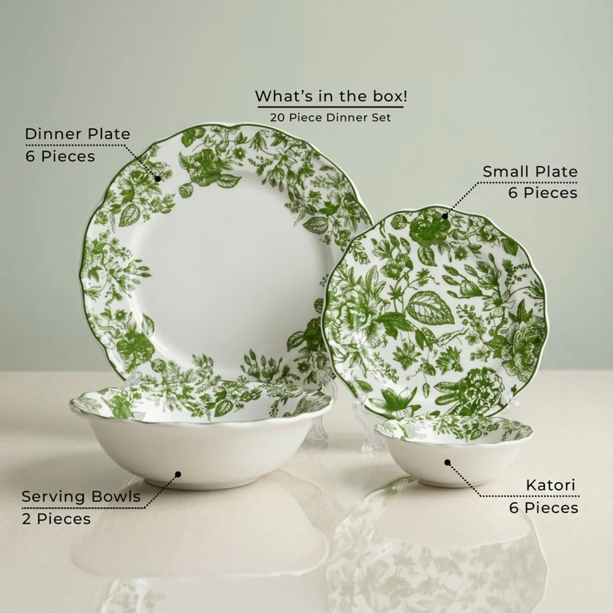 Green and white floral dinnerware set with plates and bowls displayed together