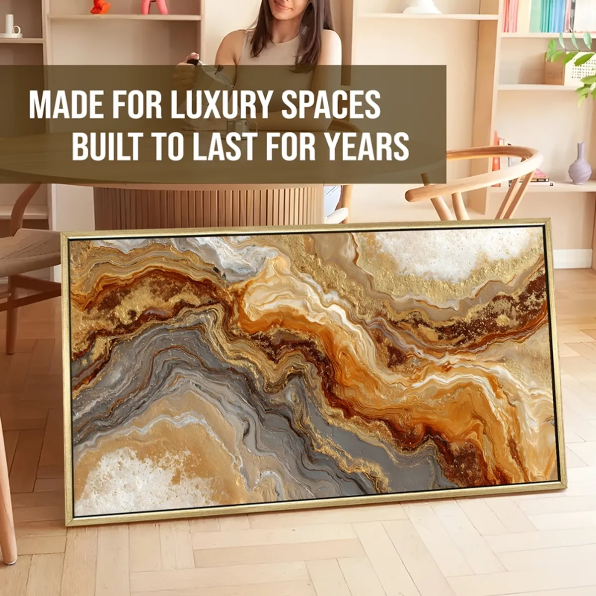 Large framed abstract canvas painting leaning in a styled room