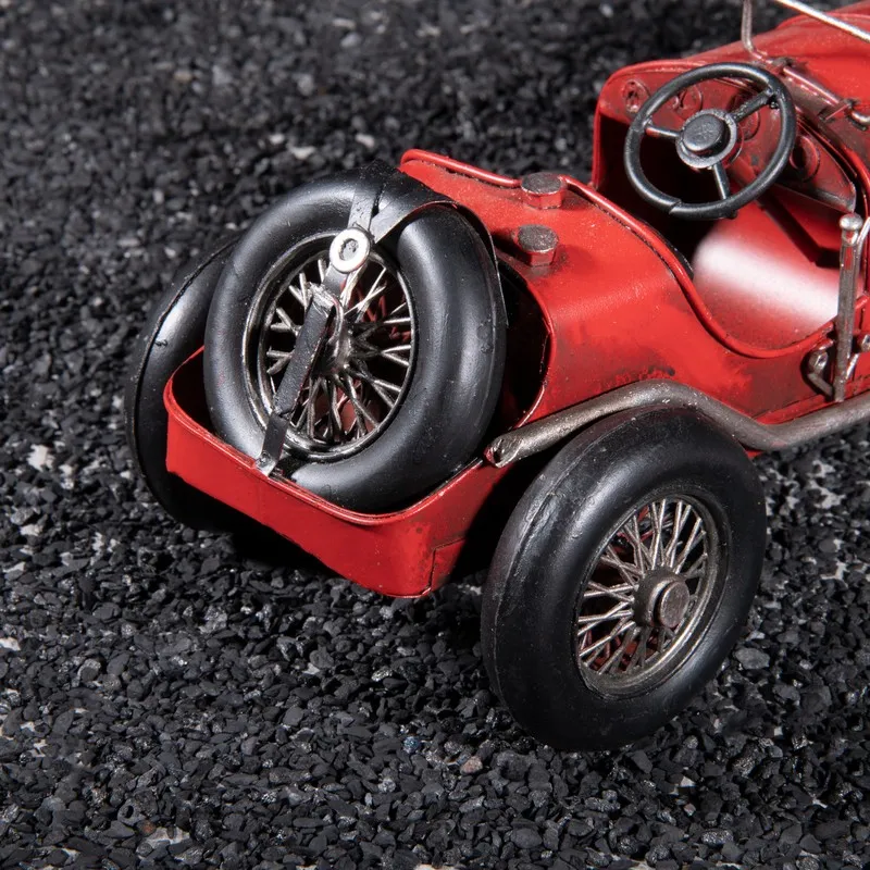 Close-up of the rear section and spare wheel of the red race car showpiece