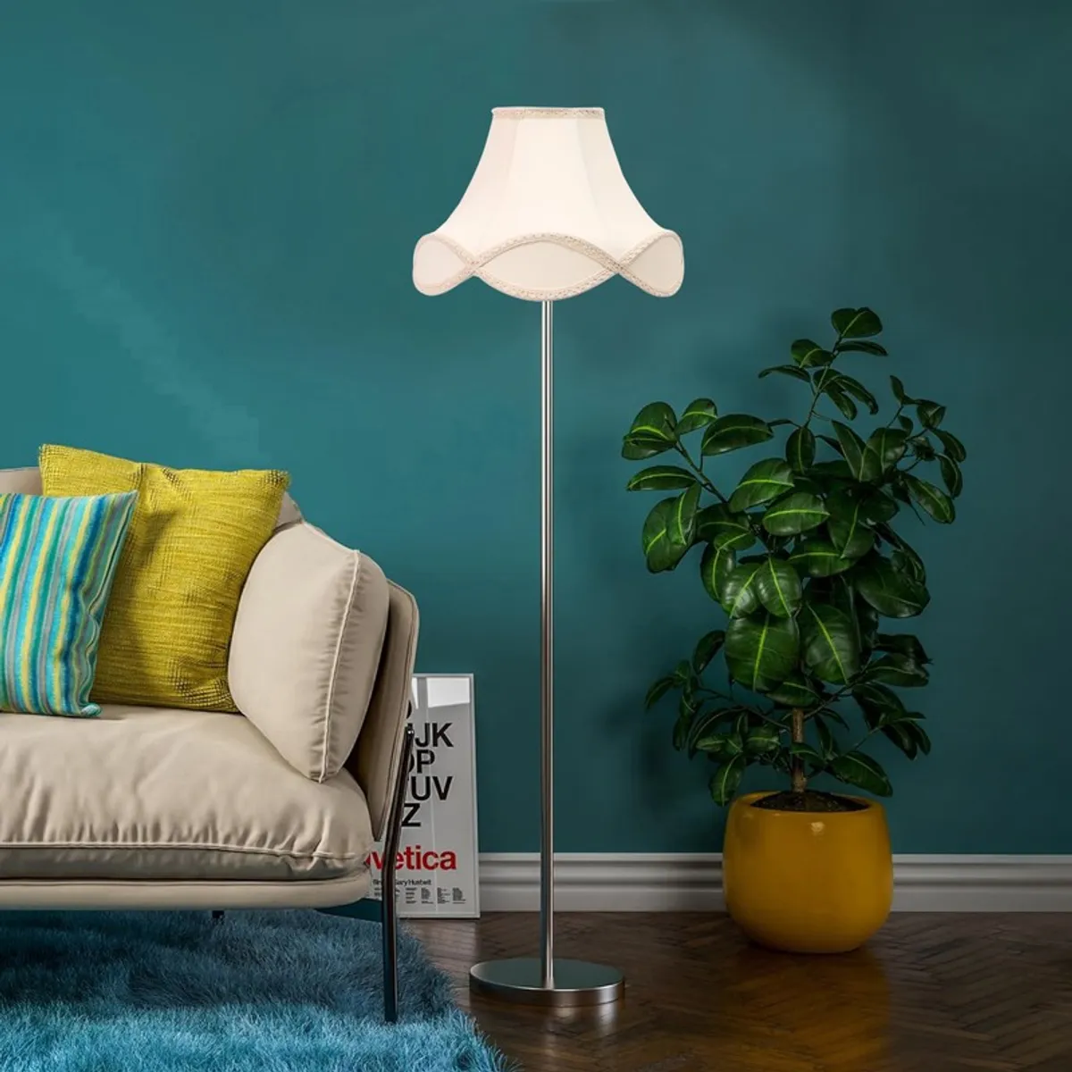 Ivory wave floor lamp with a silver base against a teal wall