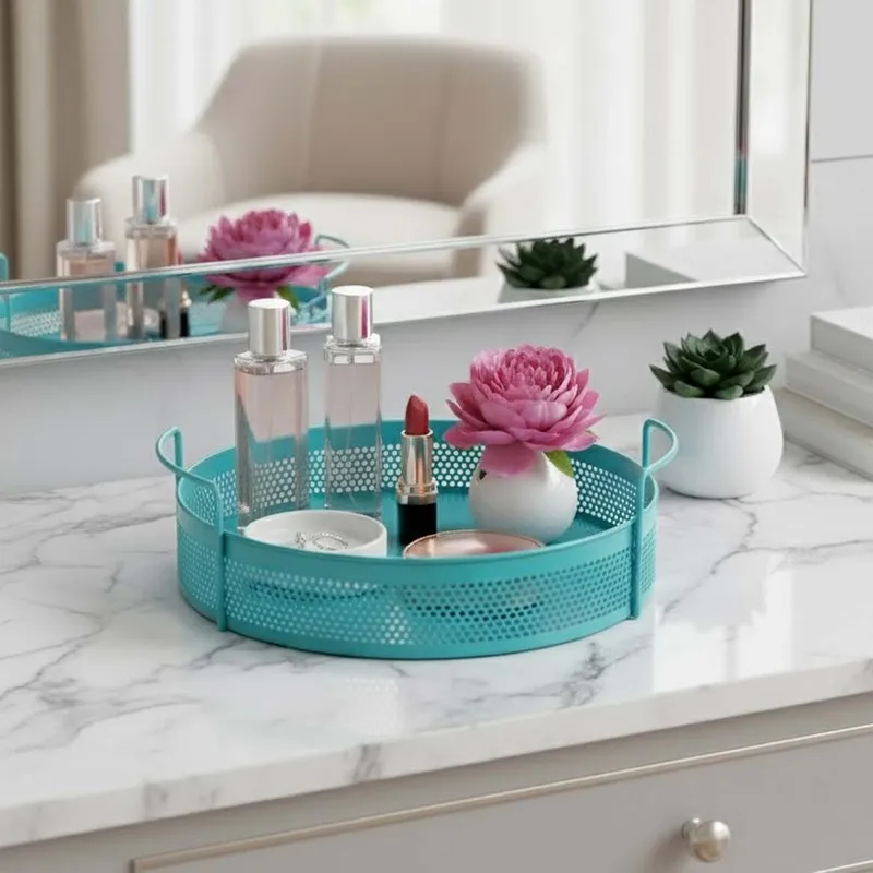 Blue round metal basket with handles used on a vanity counter