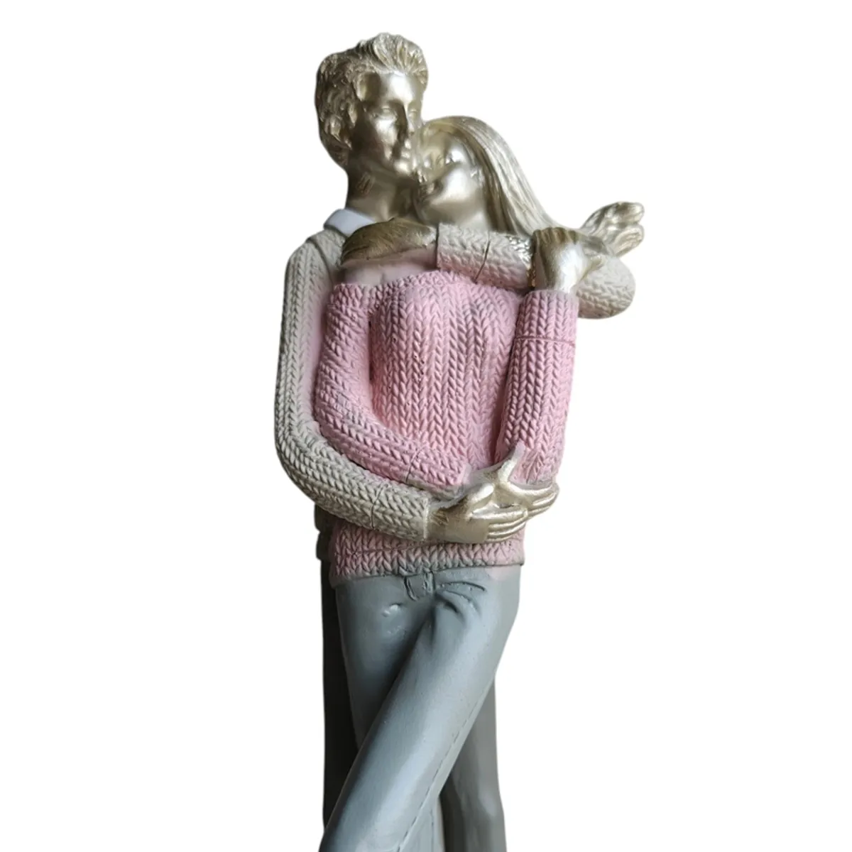 Close-up of embracing couple figurine with textured pink clothing