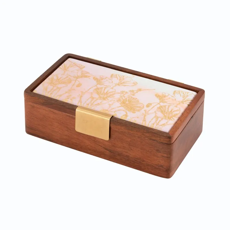 Closed rectangular brown wooden masala box with a pale floral top
