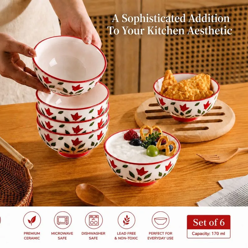 Red and white floral bowls stacked and filled with snacks and dessert