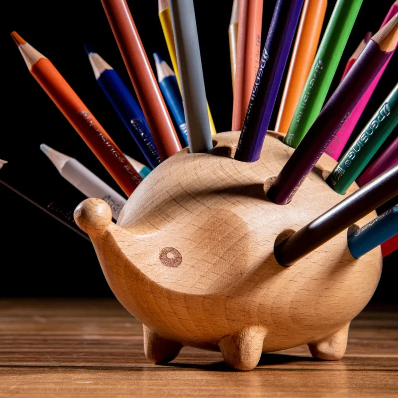 Close-up of hedgehog wooden organiser with pencil holes