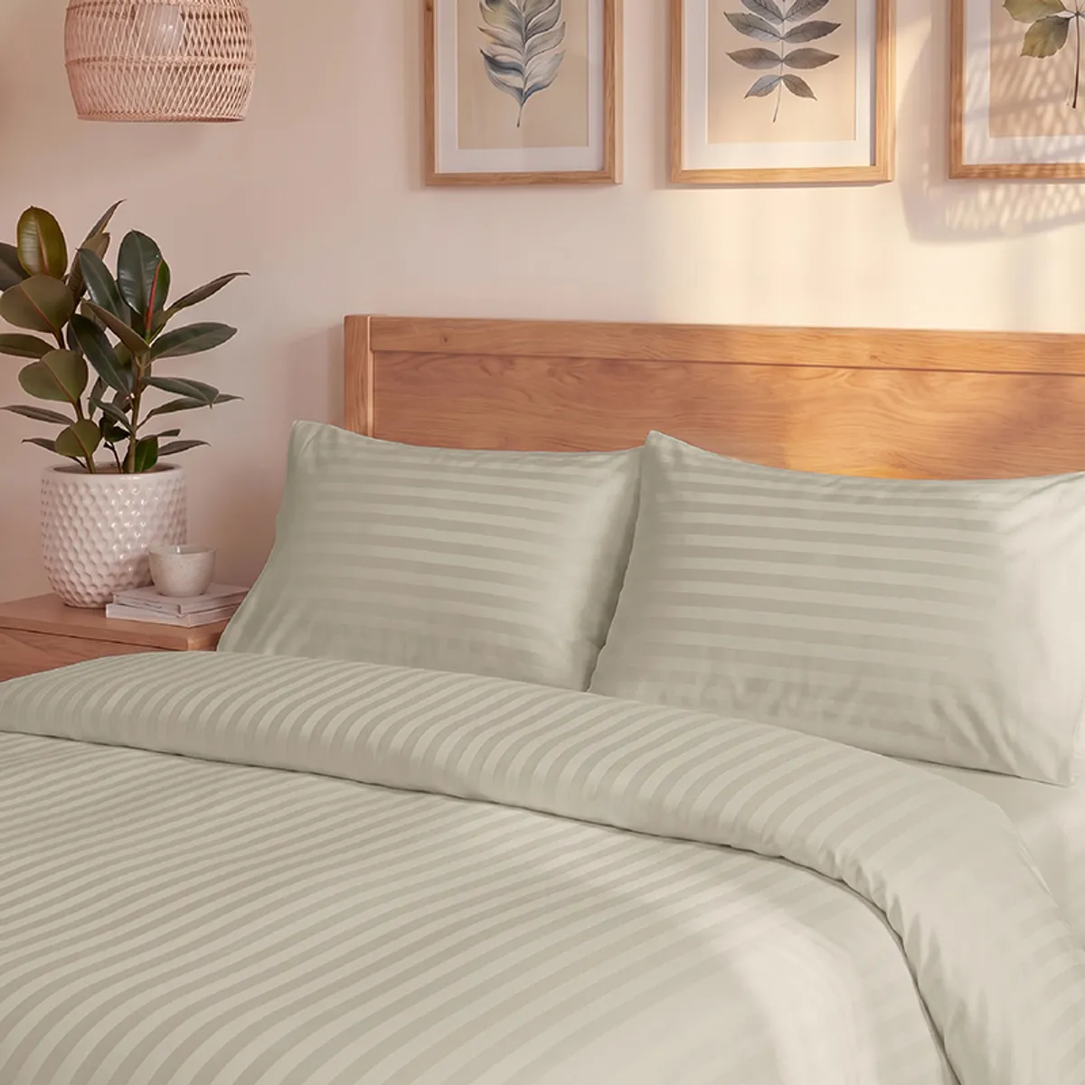 Close view of the beige striped duvet cover spread across a bed