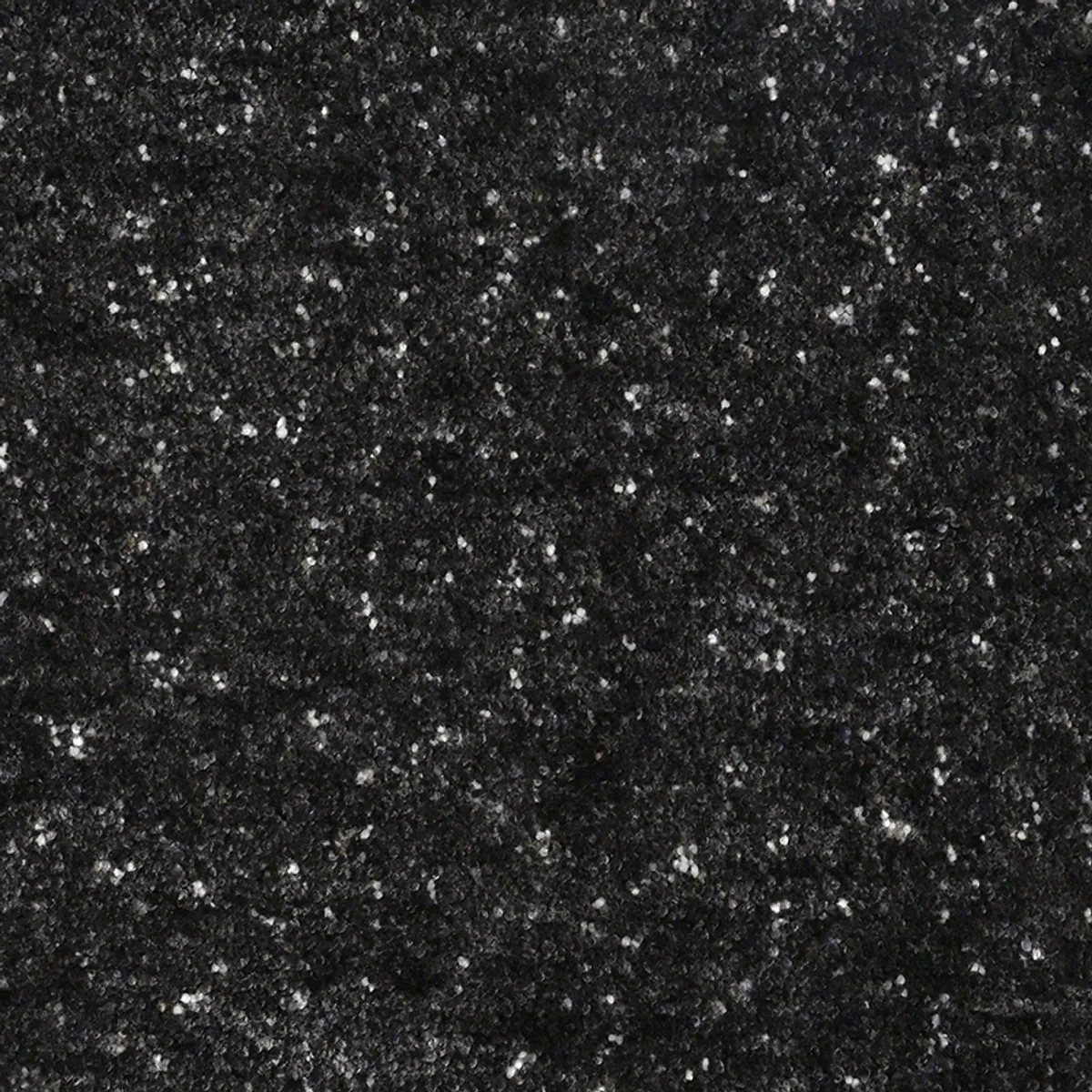 Close-up view showing the soft textured black carpet surface