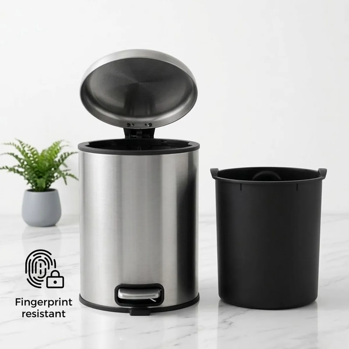 Silver metal dustbin with open lid and removable black inner bucket