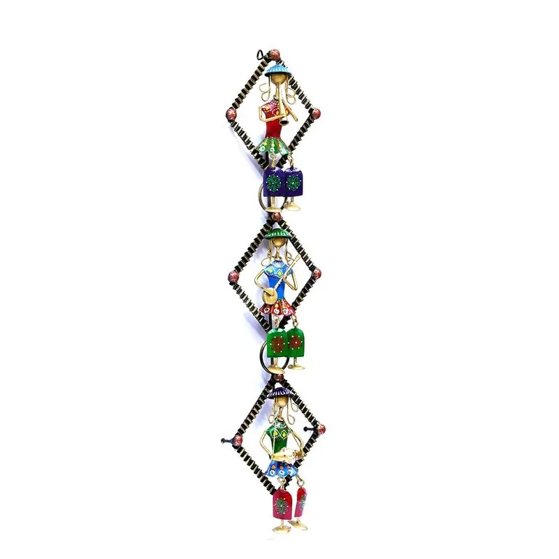 Angled view of a vertical multicolour metal wall accent with three handcrafted figurines
