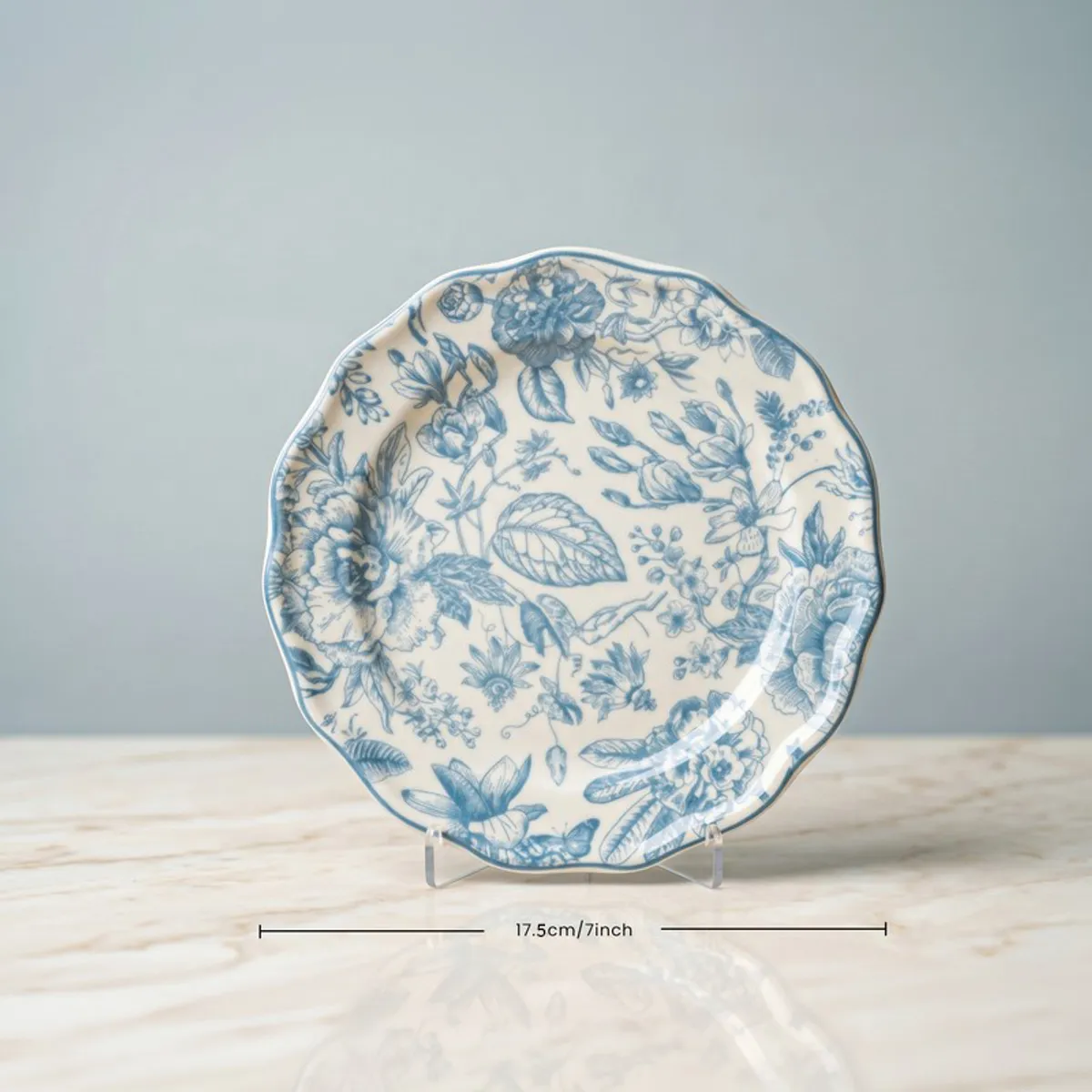 Single blue and white floral quarter plate on display stand