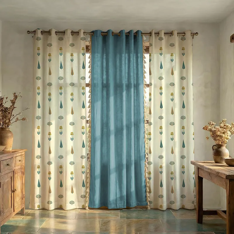 Set of three curtains with two floral white panels and one solid blue centre panel