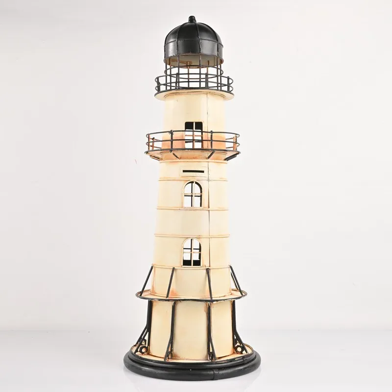 Full view of lighthouse-shaped iron showpiece in ivory and black