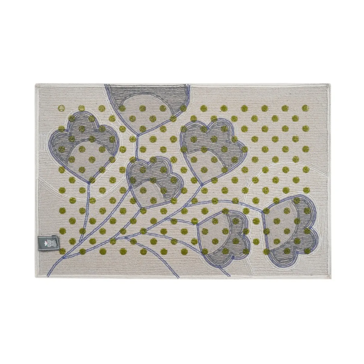 Top view of a grey bath mat with blue floral vines and green dots