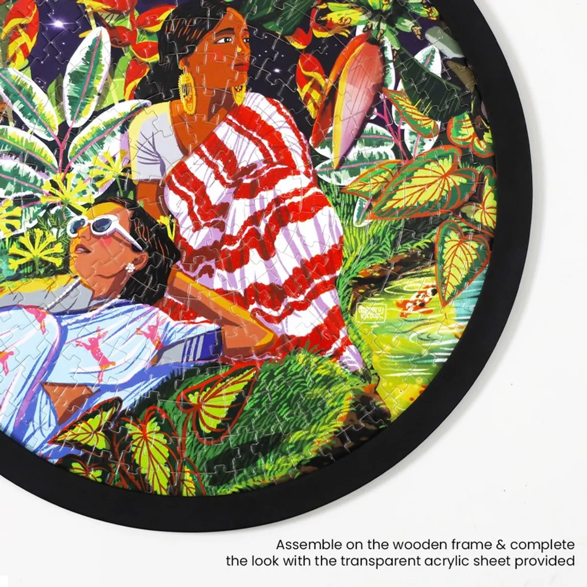 Close-up of the round framed garden artwork with vivid foliage and figures