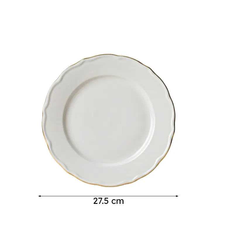 Top view of a white round dinner plate with gold rim