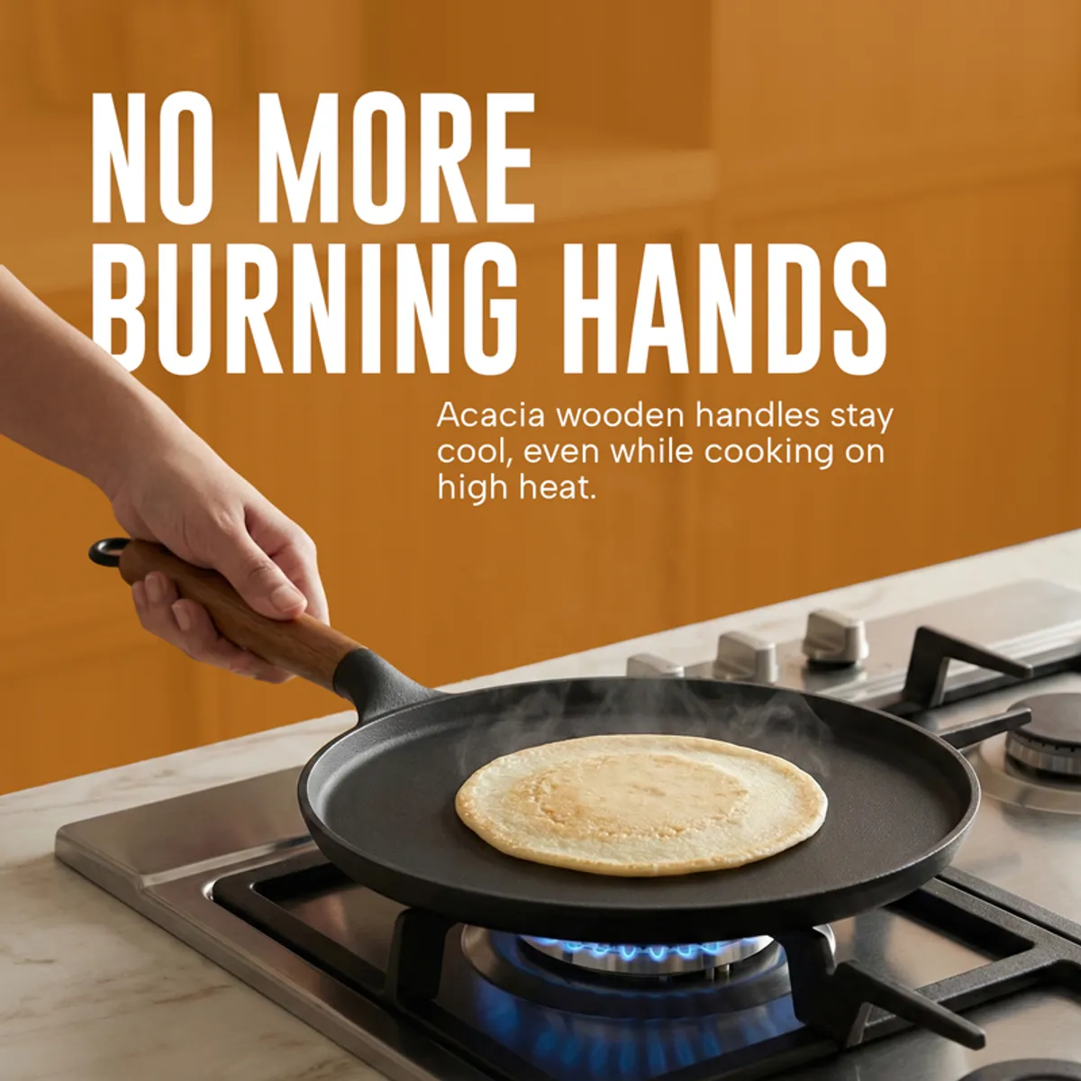 Dosa cooking in the black tawa with its wooden handle on a gas hob