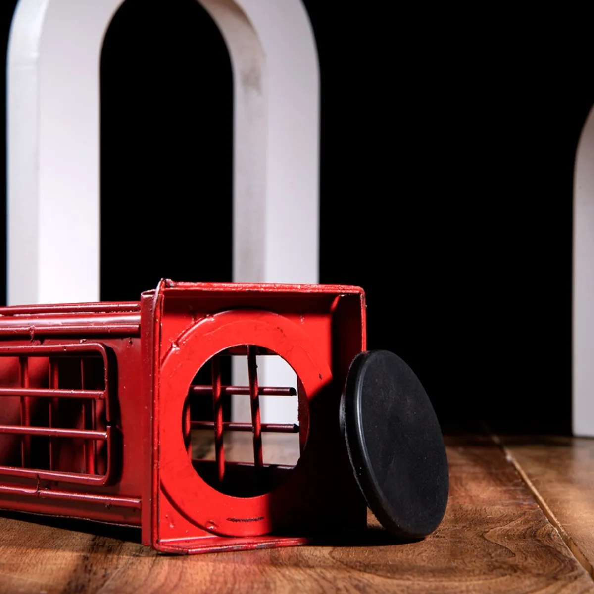 Bottom opening of the red telephone booth style coin bank showpiece