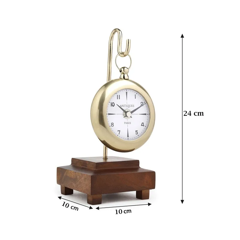 Gold table clock with suspended design on a wooden base