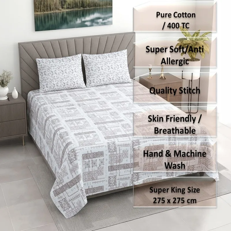 Printed bedsheet on a bed with matching pillow covers in a styled bedroom