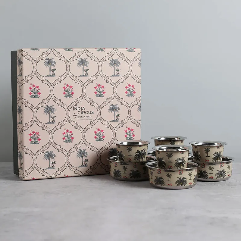 Eight-piece Bisa Brass Dabara set displayed beside its patterned gift box.