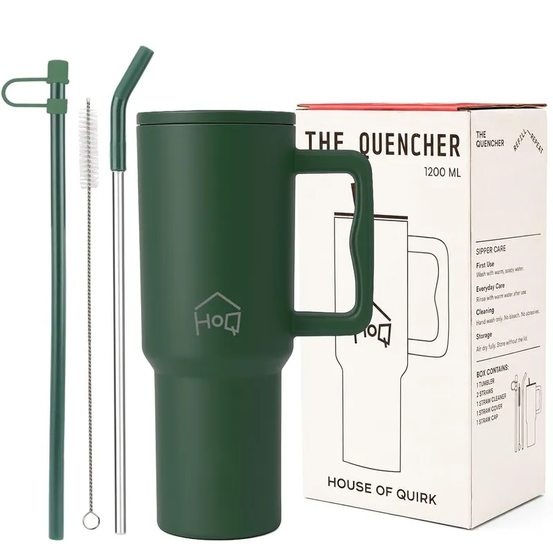 Dark green tumbler with straw pieces and cleaning brush beside box