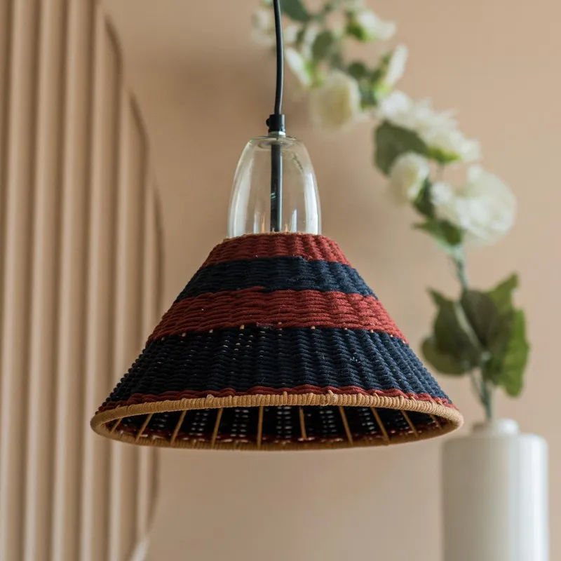 Close view of cone-shaped pendant lamp with glass top and striped shade