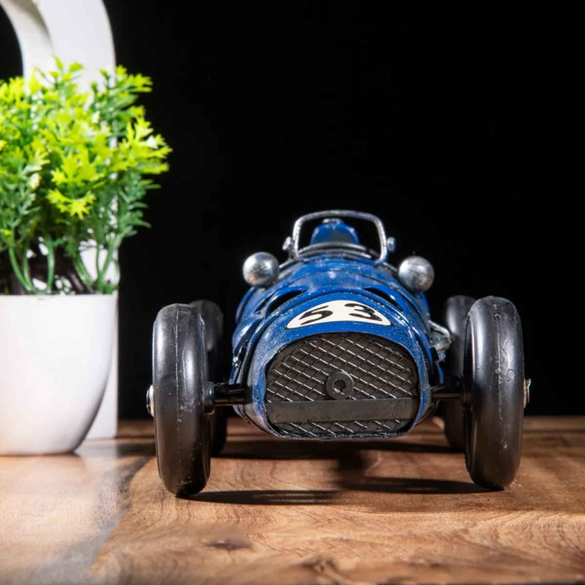Front view of blue vintage racing car decorative showpiece