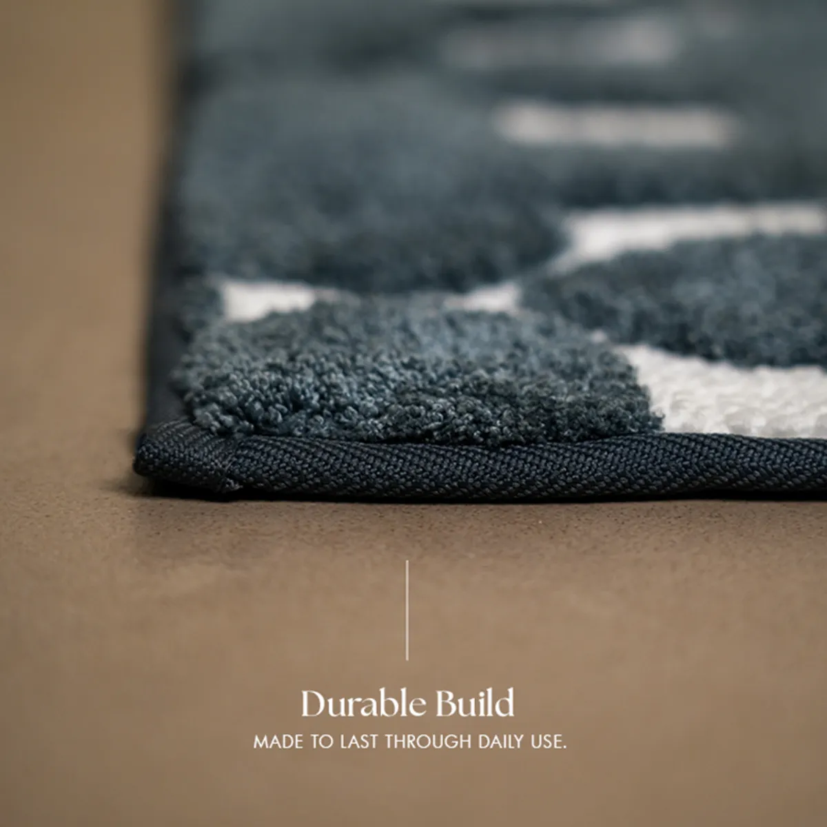 Side view showing the bath mat's textured surface and finished edge