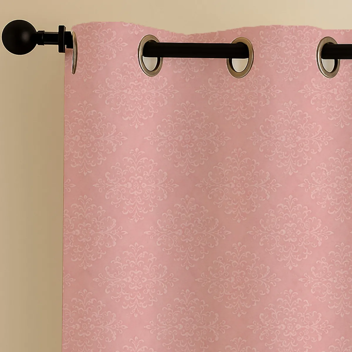 Close-up of pink curtain with eyelet top and damask-style print