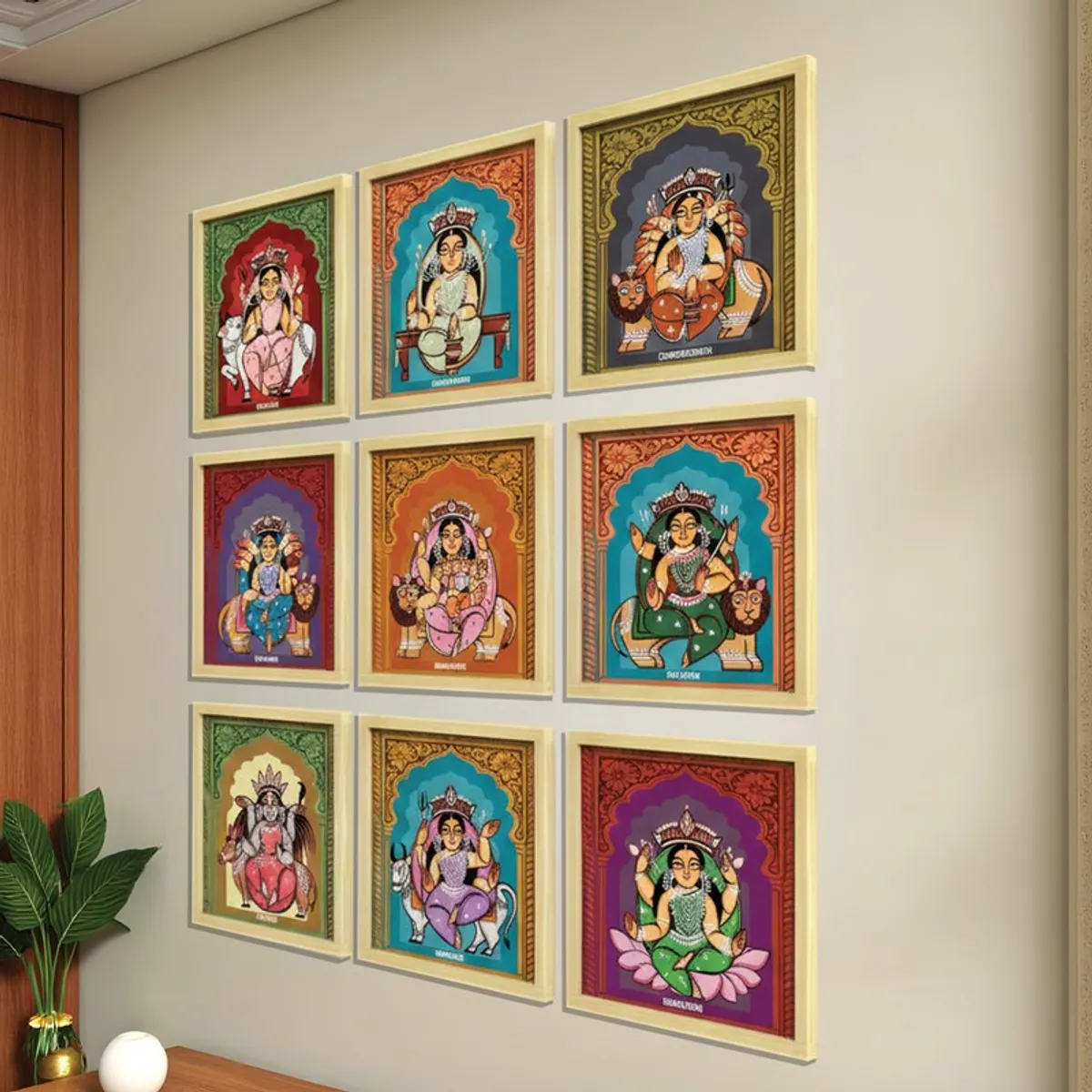 Nine framed Durga artworks displayed in a three-by-three arrangement on a living room wall