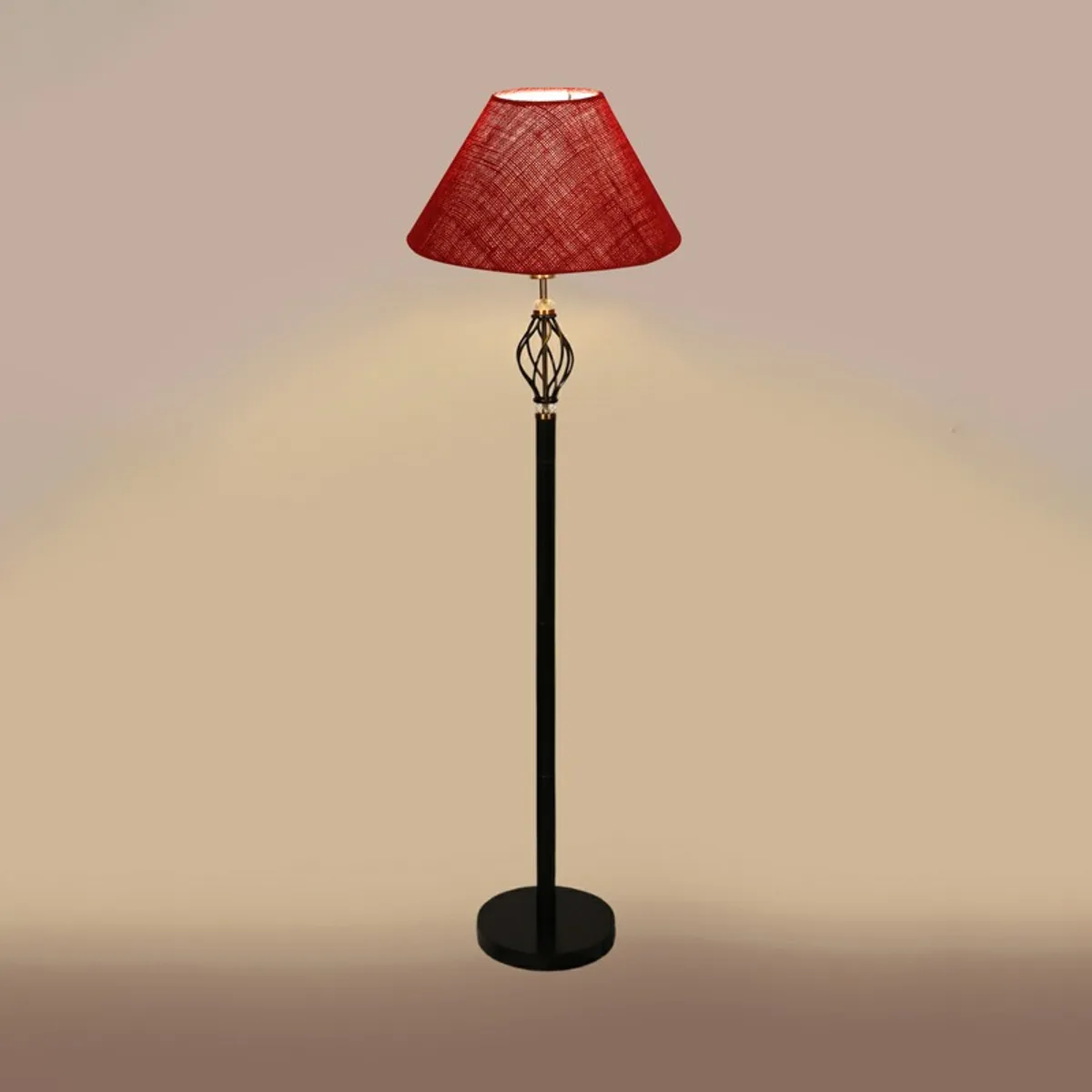 Red floor lamp lit against a beige background.