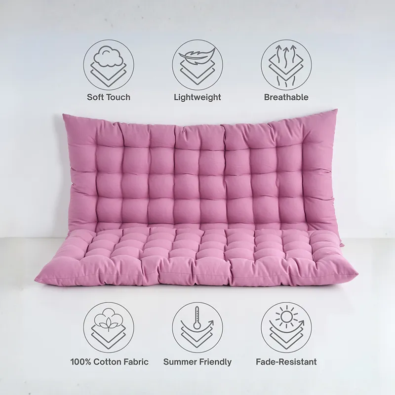 Lilac purple floor cushion with tufted rectangular design on a white surface