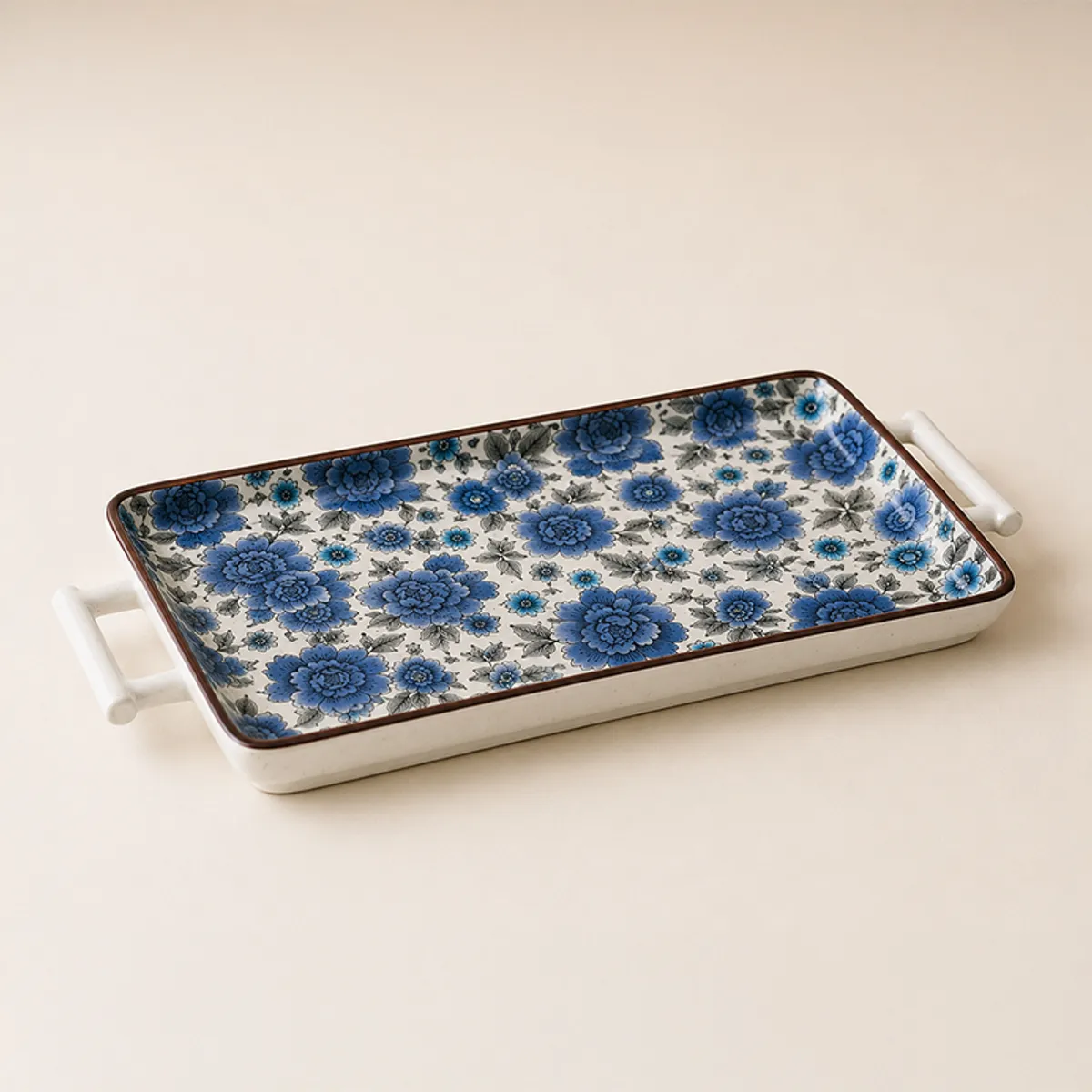 Blue and white floral serving tray with raised edges and handles